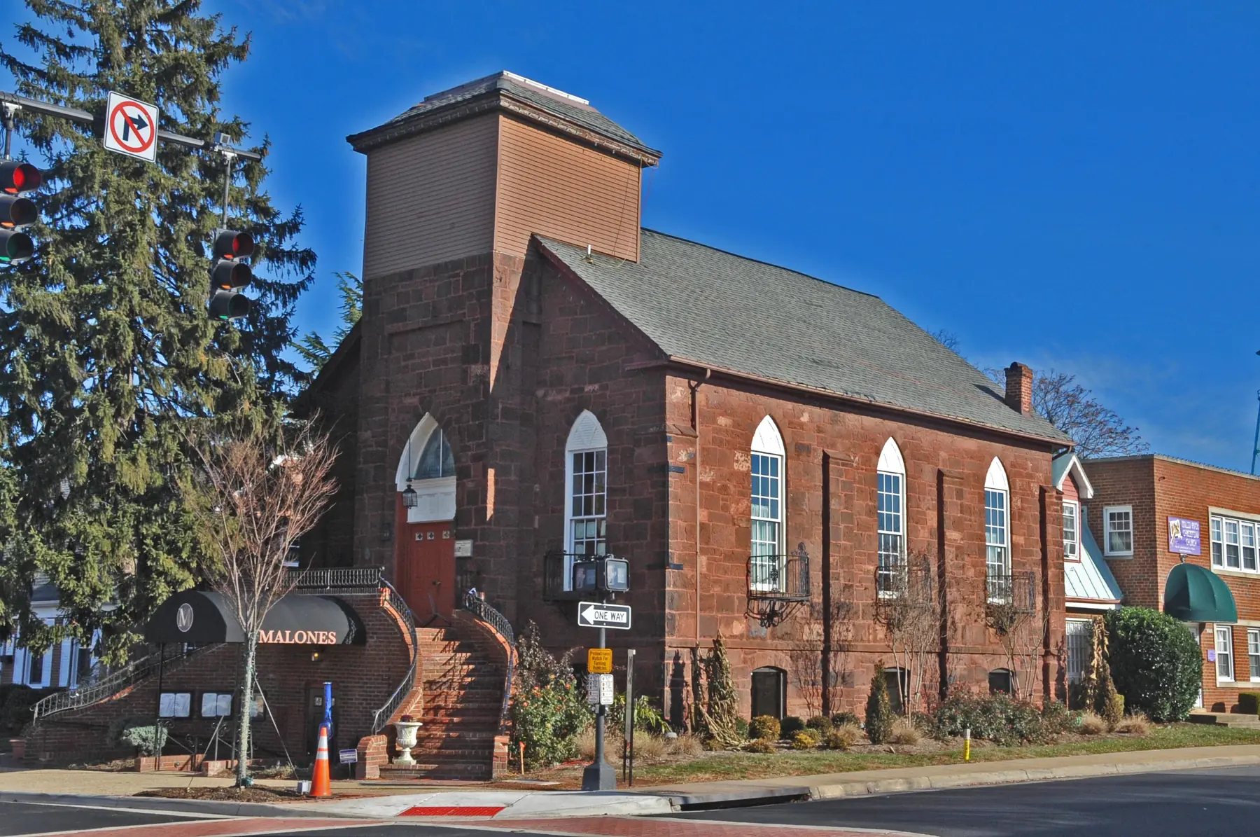 A sandstone church built in 1875, now used by a business, on a corner in the Manassas Historic District, where exterior changes need Architectural Review Board approval.