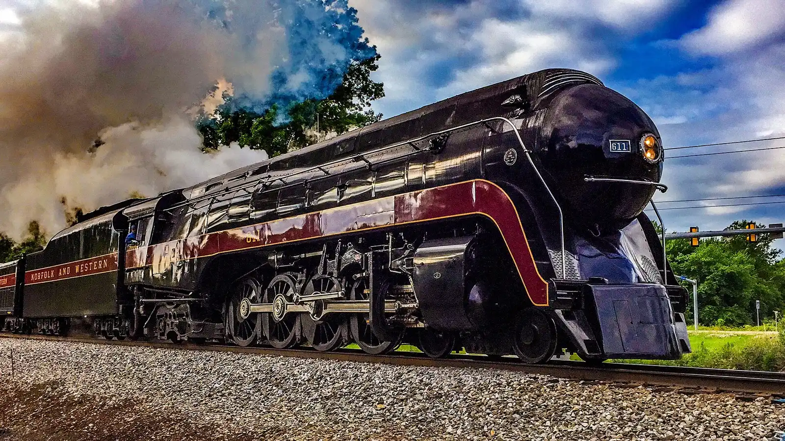 The Norfolk and Western Class J 611 steam locomotive passing the Rixlew Lane crossing in Manassas on an excursion run.