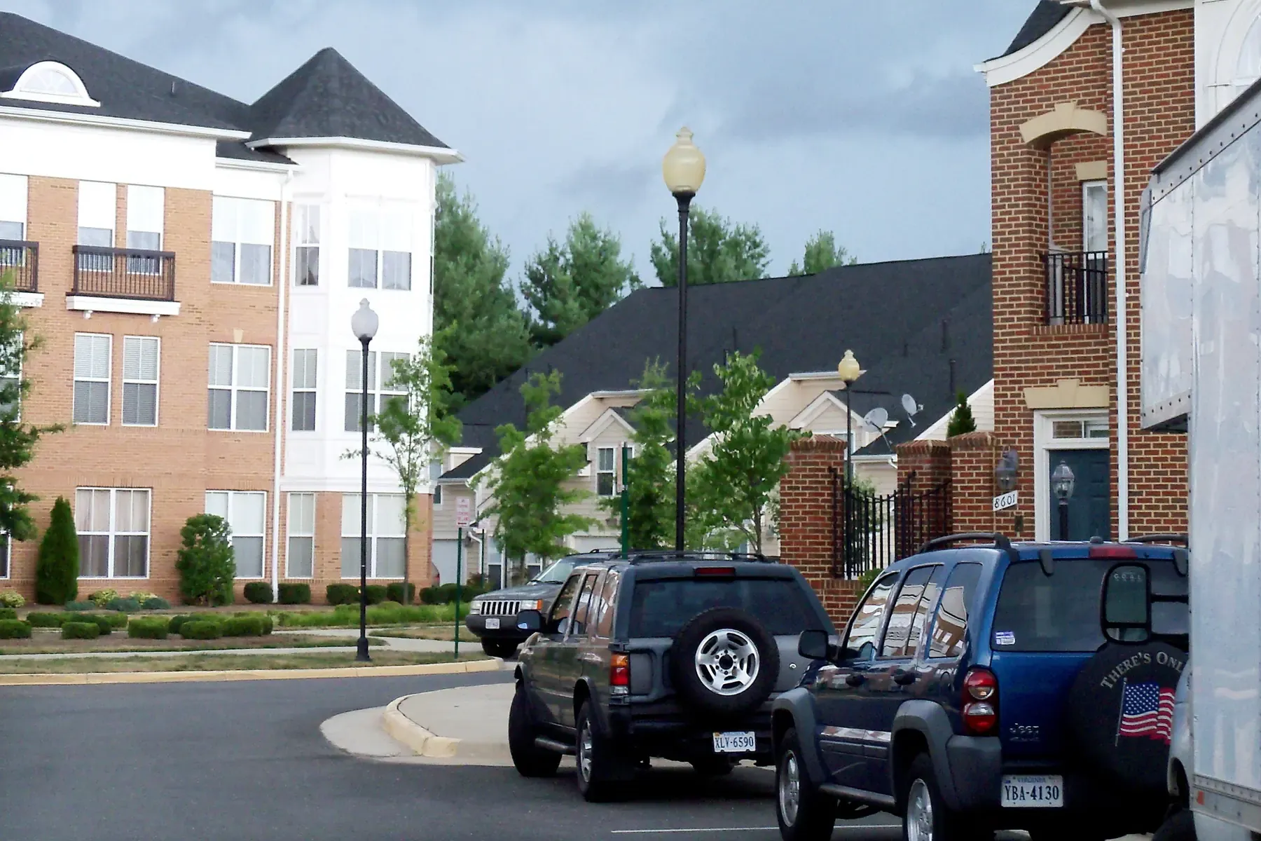 Brick apartment buildings and townhouses along a residential street in Manassas.