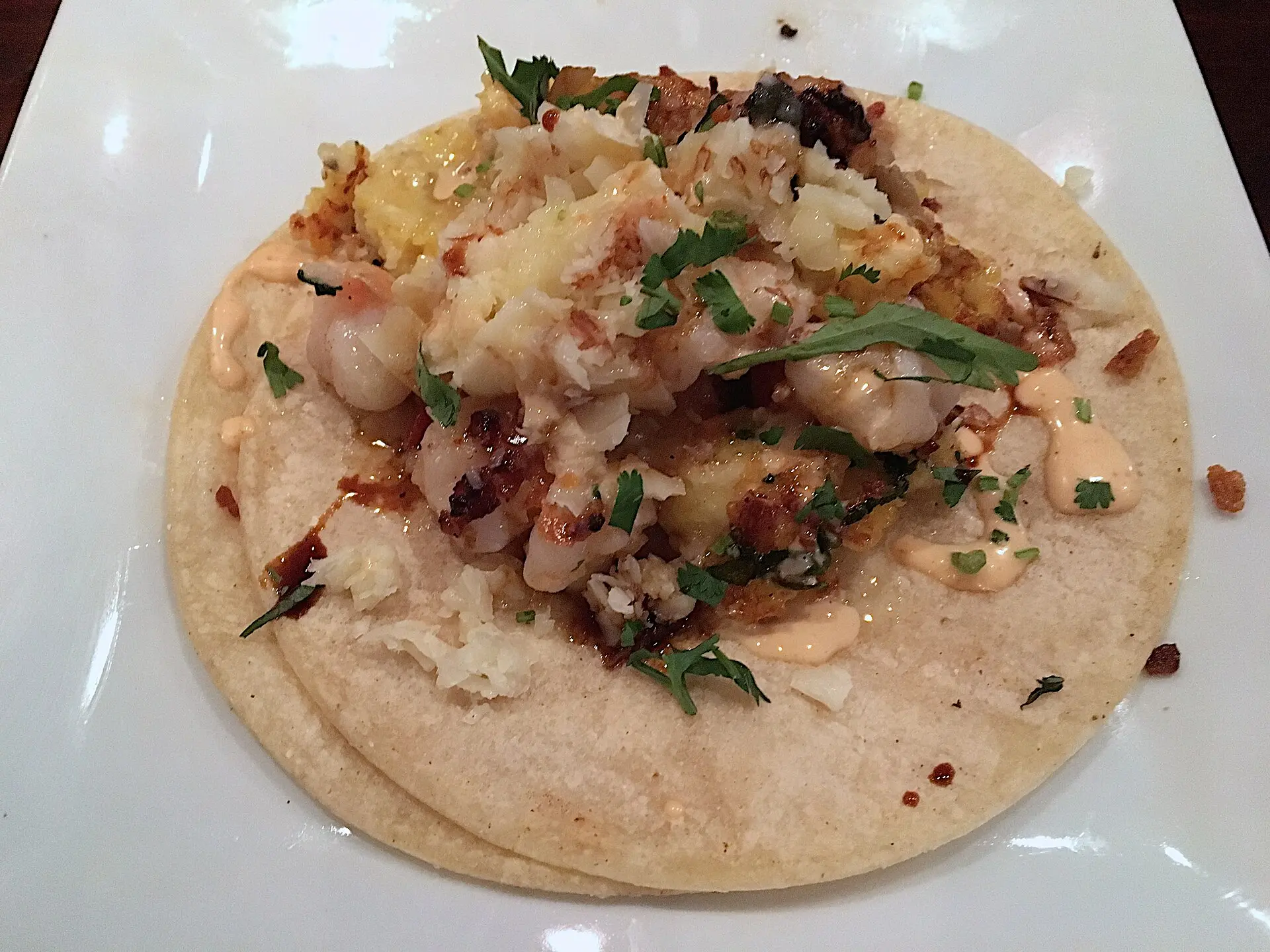 Shrimp tacos on a plate. The photo was not taken at any restaurant on this list.