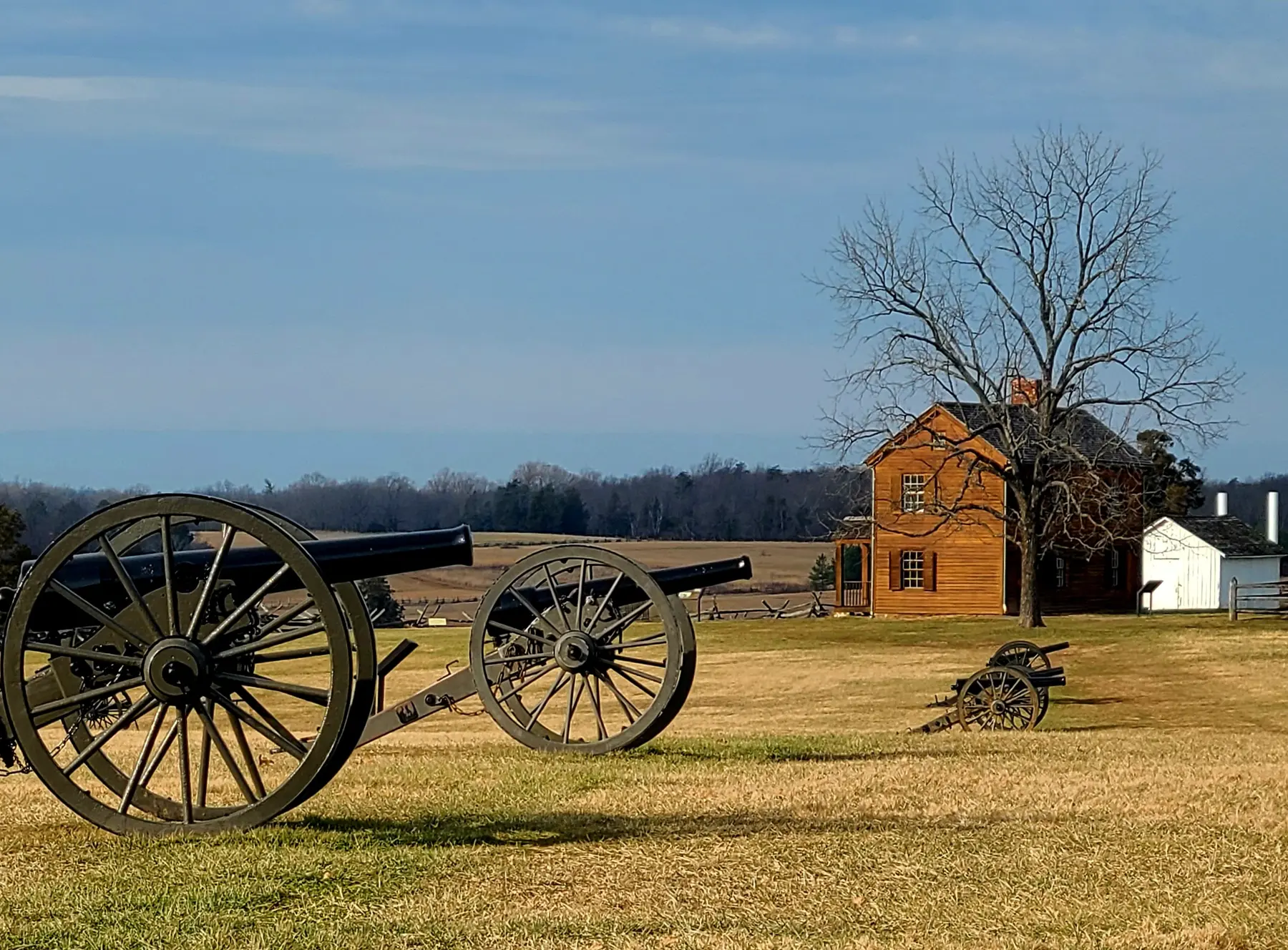 Cannons on Henry Hill at Manassas National Battlefield Park, with the Henry House behind, where the park's loop trails begin.