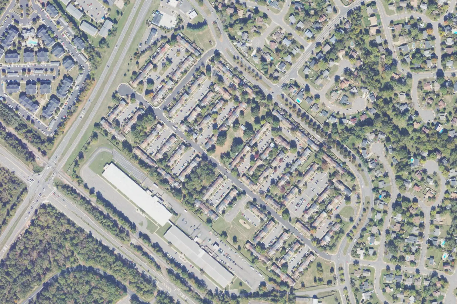 An aerial view of Bristoe Station in west Manassas, with rows of townhouses and their parking courts west of Ashton Avenue.