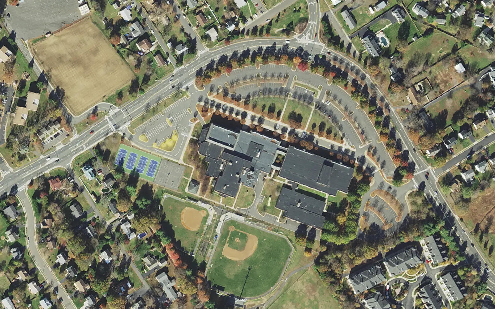 Grace E. Metz Middle School from the air, with its ball fields and courts beside Wellington Road in Manassas.